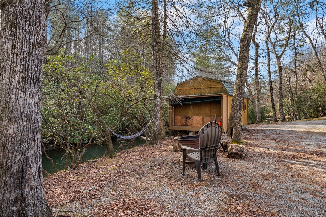 260 Hickory Ridge Mountain Rest, SC 29664 - Photo 27 of 39 This serene woodland retreat offers a charming shed beside a tranquil creek.