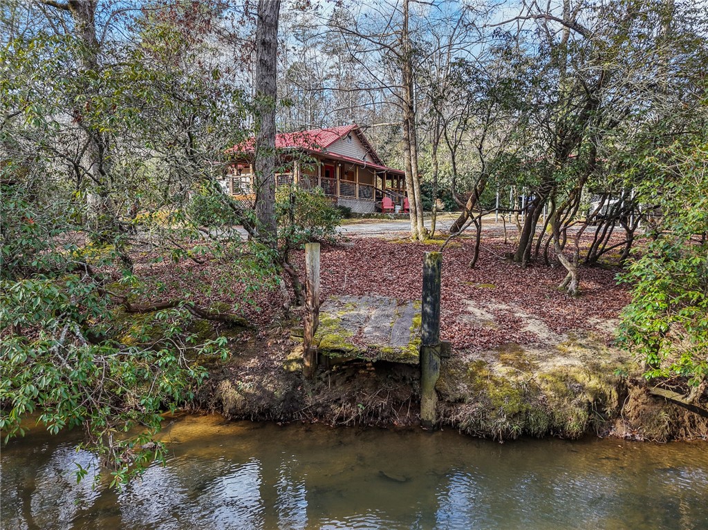 260 Hickory Ridge Mountain Rest, SC 29664 - Photo 29 of 39 This tranquil waterfront retreat offers a charming dwelling nestled amongst lush trees.