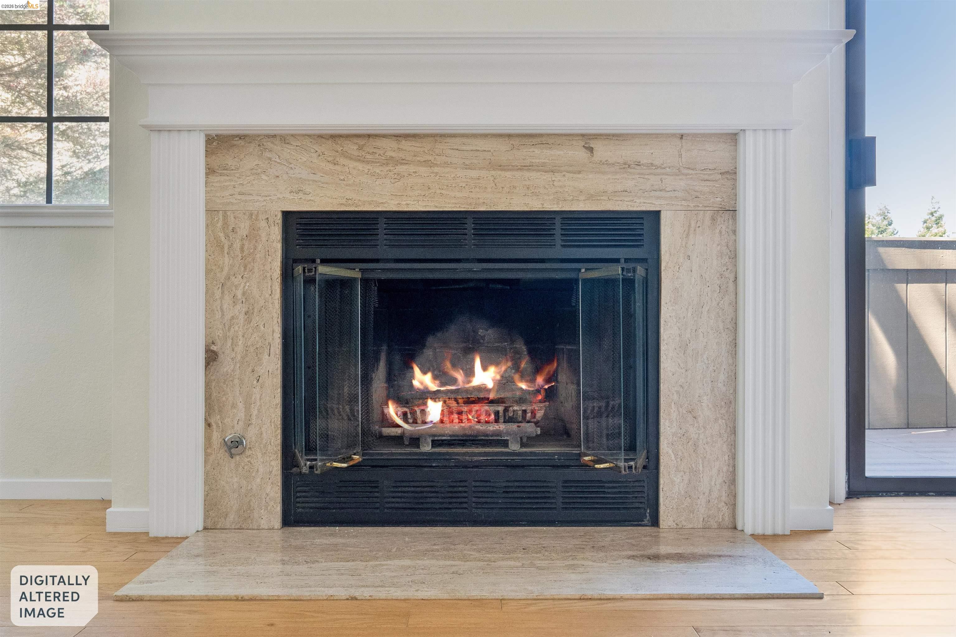 261 Redhawk Road Novato, CA 94949 - Photo 13 of 44 Fireplace featuring a stone surround, white mantel, and wood-finish flooring