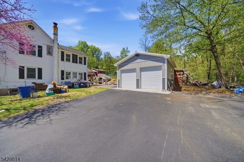 251 Russia Road Oak Ridge, NJ 07438 - Photo 26 of 34 a view of a street with a house in the background
