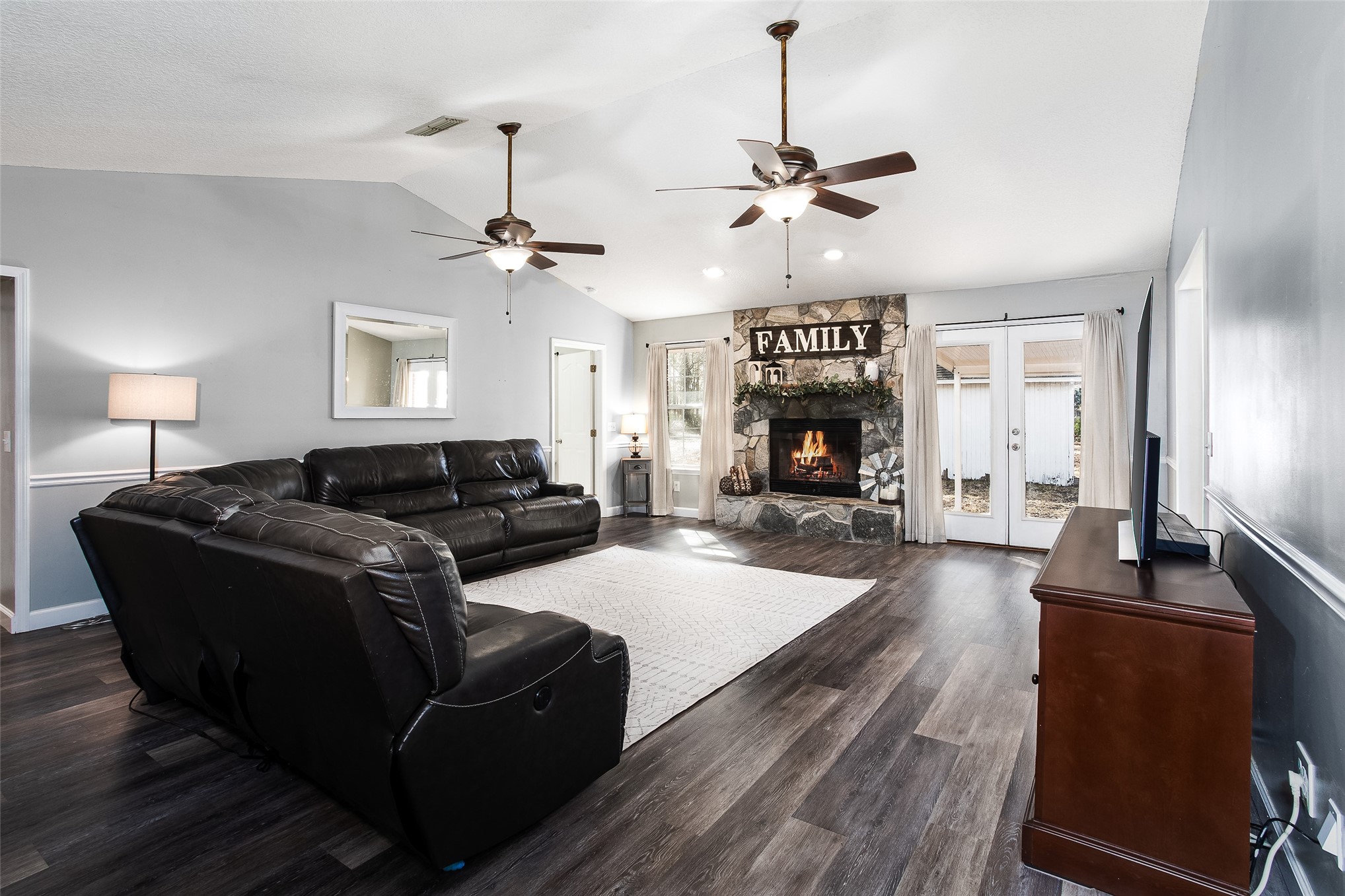 17098 Cross Branch Road Hilliard, FL 32046 - Photo 11 of 71 a living room with fireplace furniture and a wooden floor