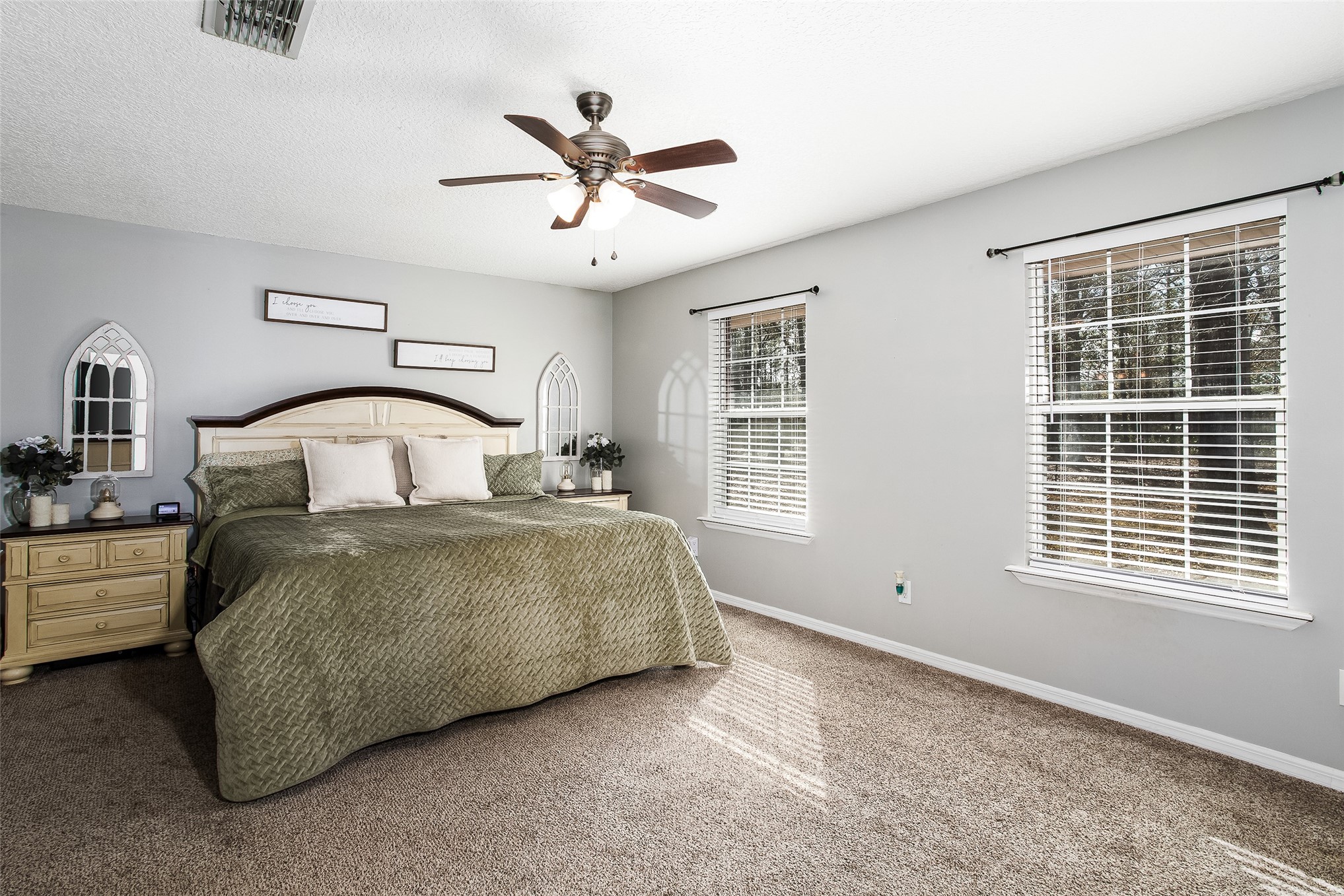 17098 Cross Branch Road Hilliard, FL 32046 - Photo 18 of 71 a bedroom with a large bed and a window