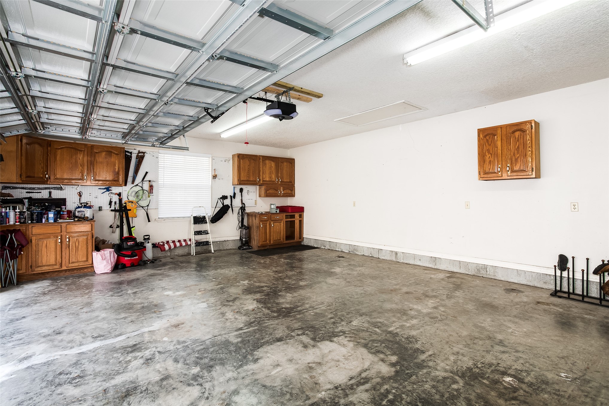 17098 Cross Branch Road Hilliard, FL 32046 - Photo 20 of 48 Remote Garage Door and Storage Cabinets