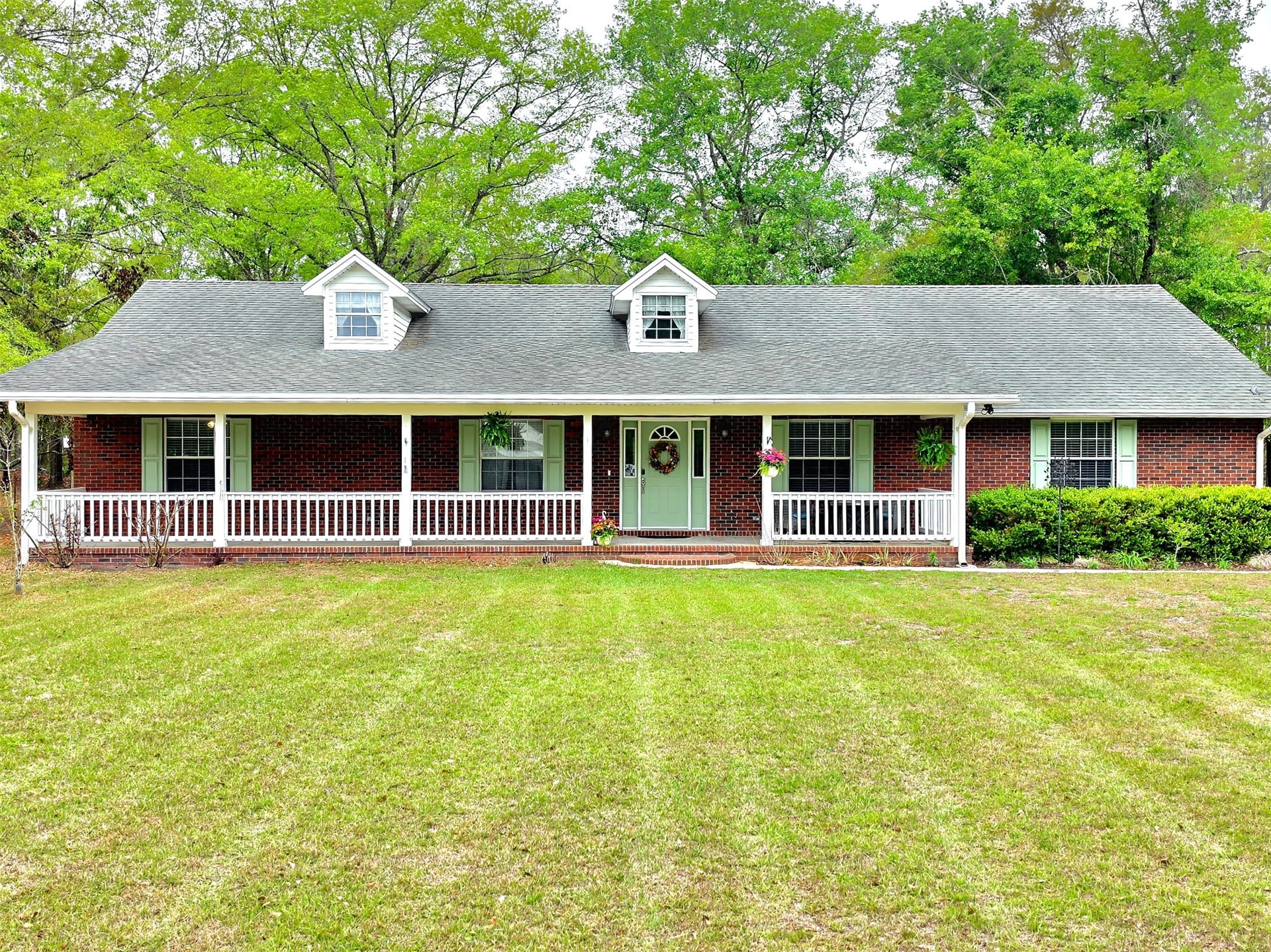 17098 Cross Branch Road Hilliard, FL 32046 - Photo 2 of 71 a front view of a house with a large pool