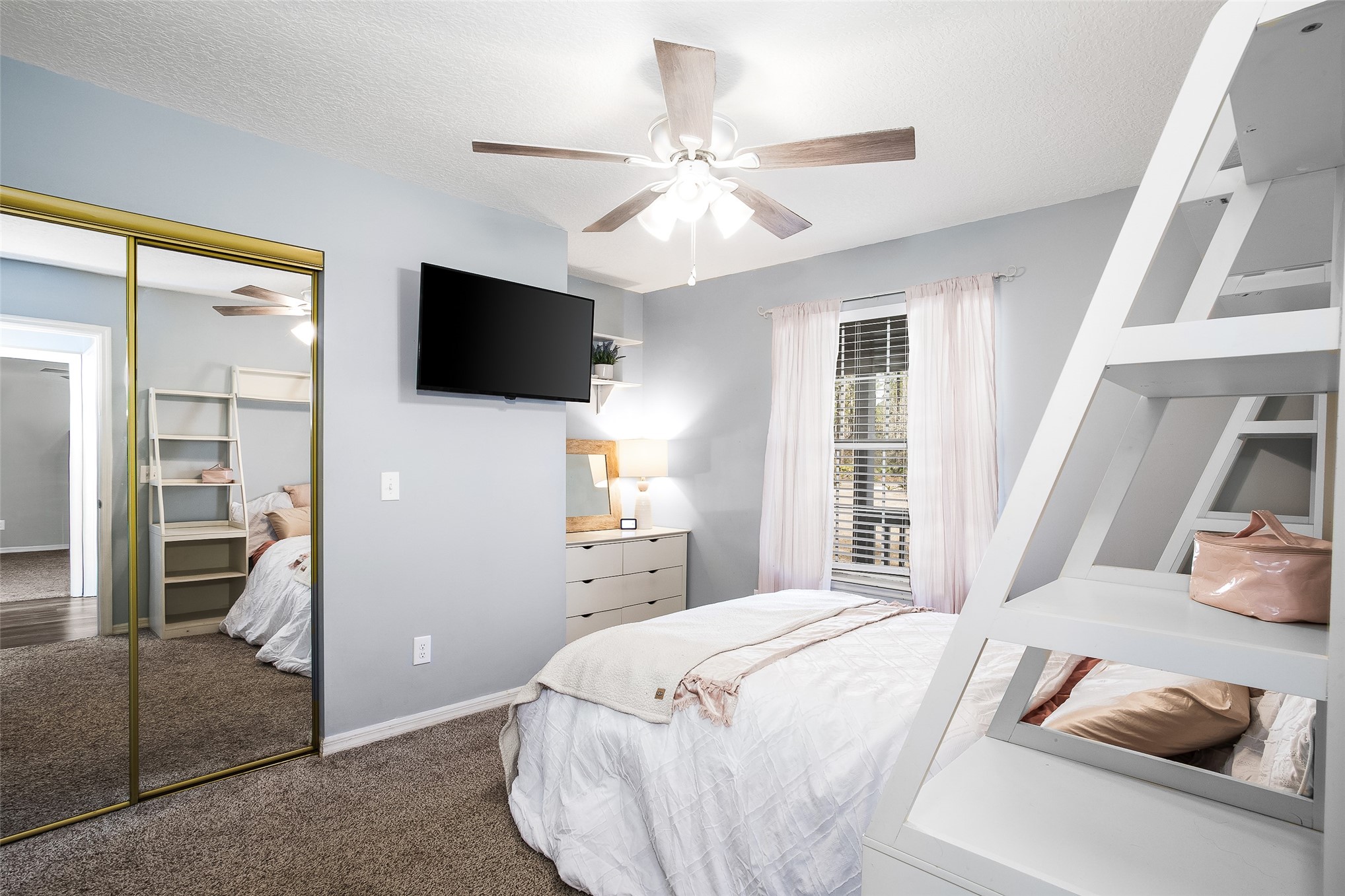 17098 Cross Branch Road Hilliard, FL 32046 - Photo 22 of 71 a bedroom with a bed and a flat screen tv