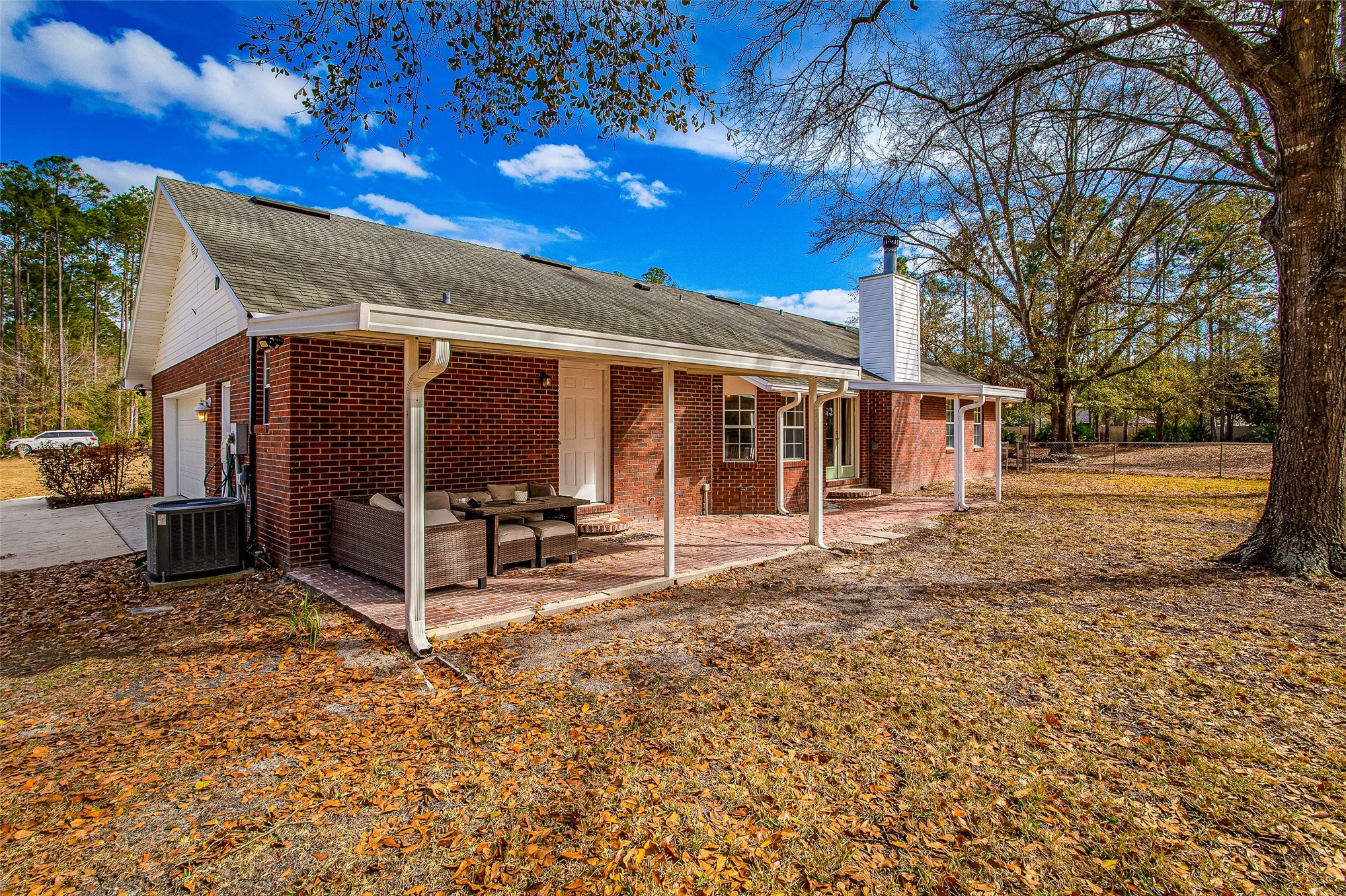 17098 Cross Branch Road Hilliard, FL 32046 - Photo 31 of 71 Covered Brick Patio with Gutters