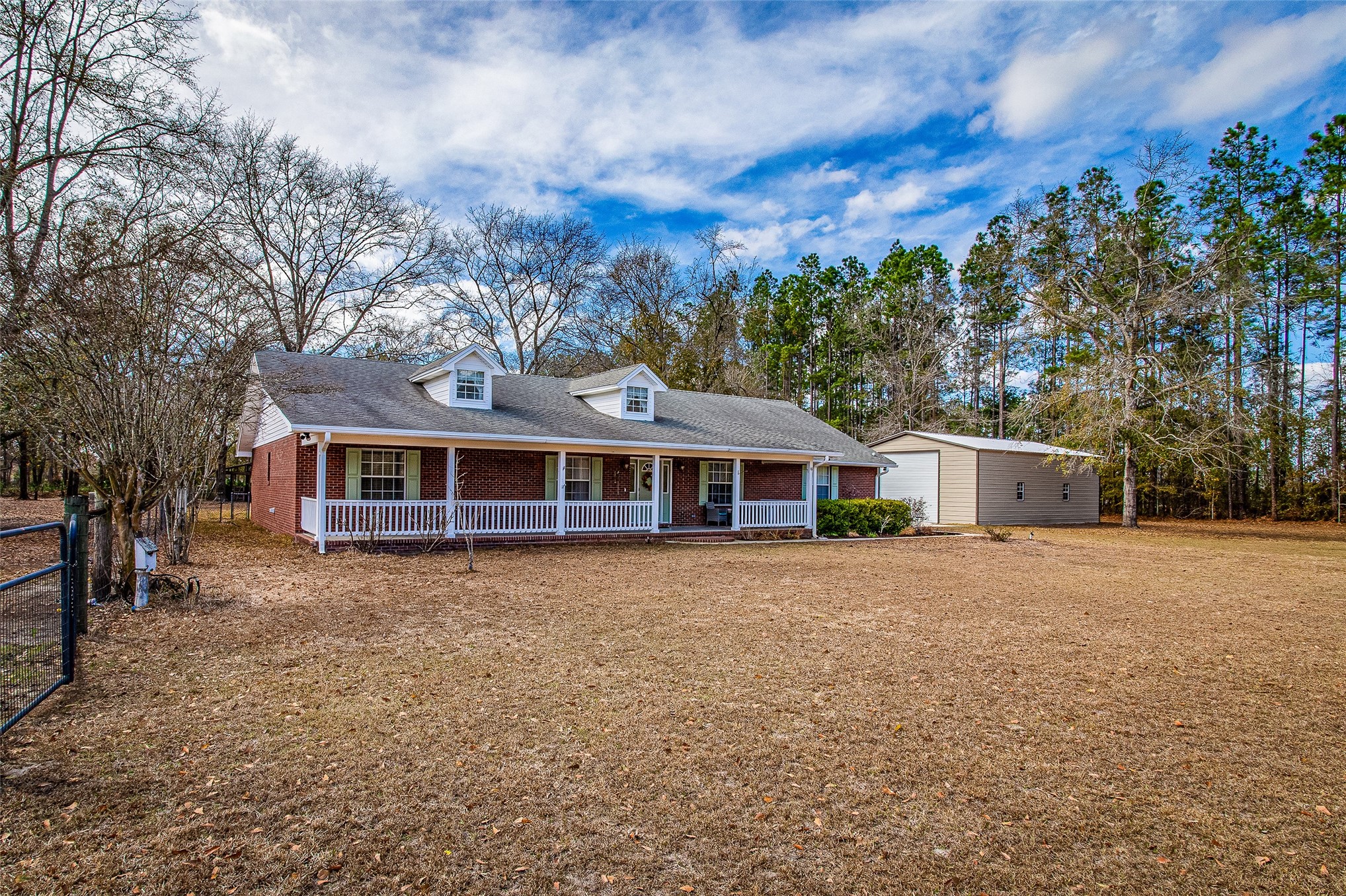 17098 Cross Branch Road Hilliard, FL 32046 - Photo 44 of 71 a front view of a house with a garden