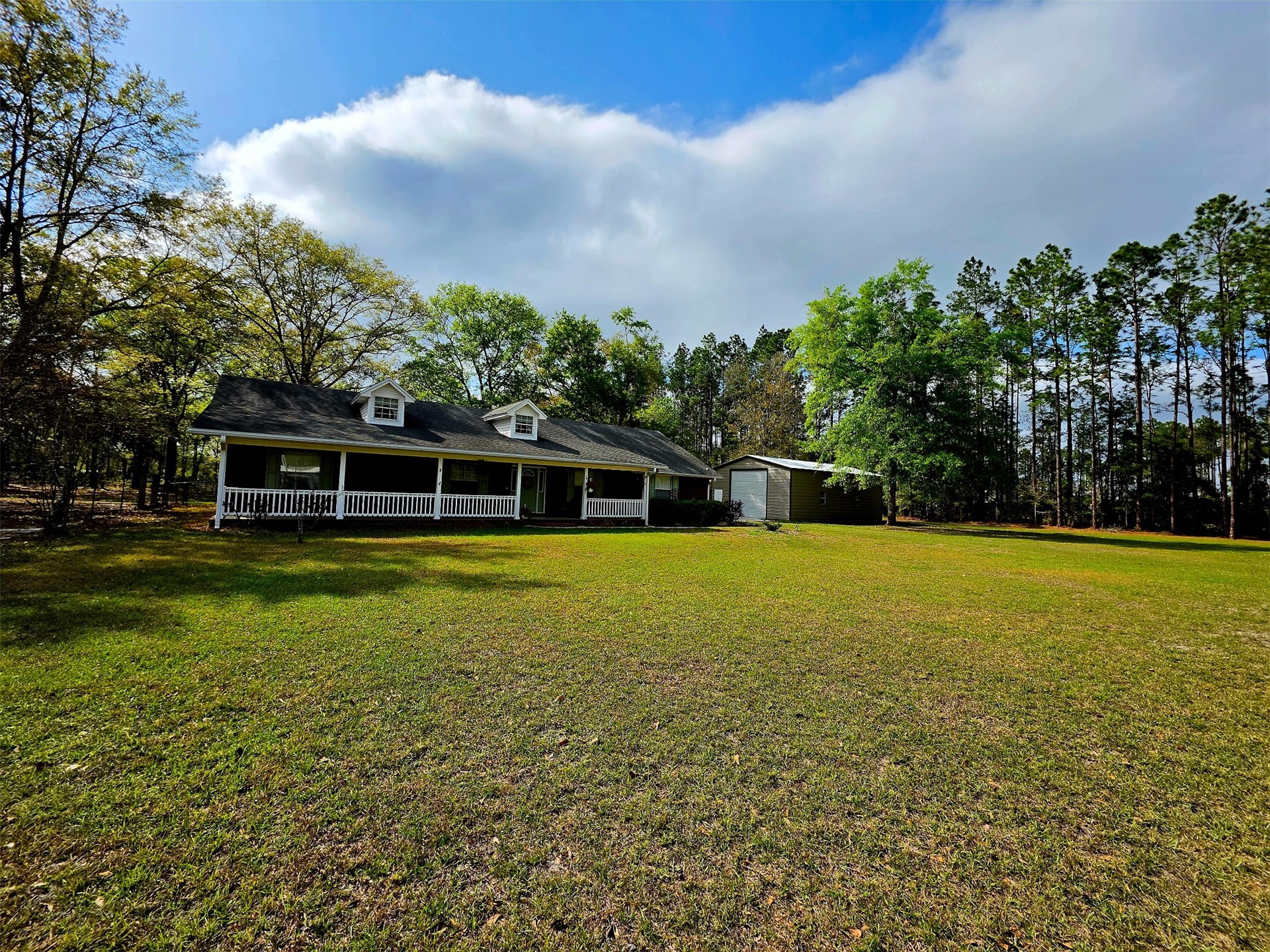 17098 Cross Branch Road Hilliard, FL 32046 - Photo 62 of 71 a view of a house with a yard
