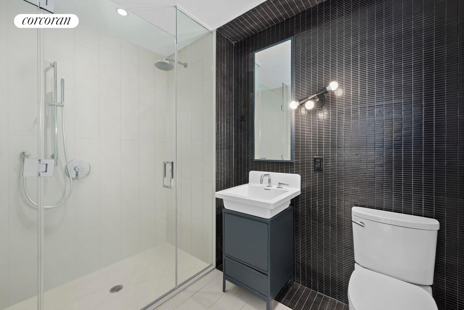 54 Noll Street, Unit 715 Brooklyn, NY 11206 - Photo 5 of 28 a bathroom with a toilet sink and shower