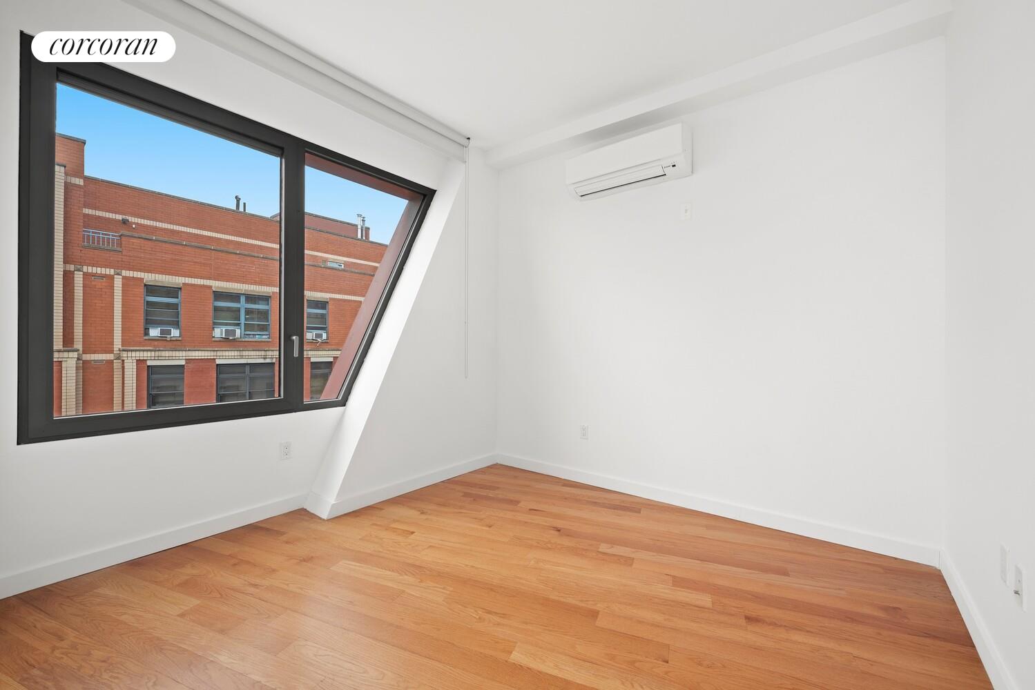 54 Noll Street, Unit 715 Brooklyn, NY 11206 - Photo 6 of 28 a view of an empty room with a window