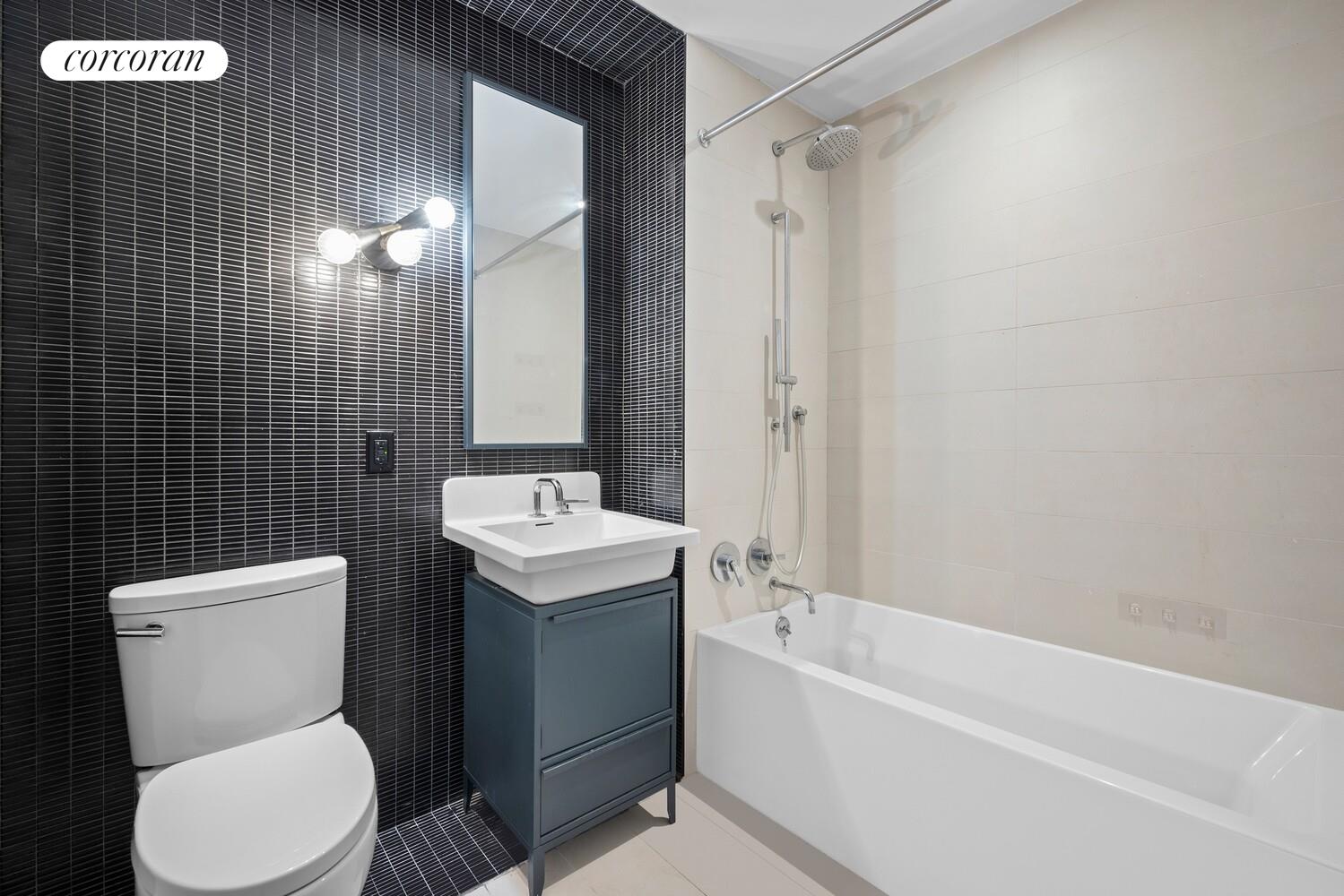 54 Noll Street, Unit 715 Brooklyn, NY 11206 - Photo 7 of 28 a bathroom with a toilet sink and shower