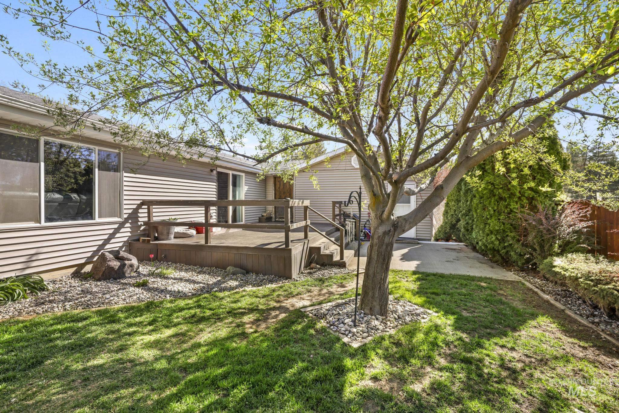 309 North Grape Street Shoshone, ID 83352 - Photo 20 of 26 View of green lawn featuring a wooden deck