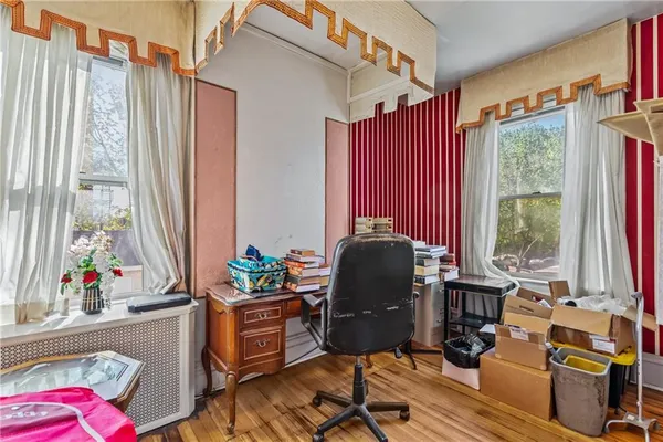 a bed room with furniture and a window