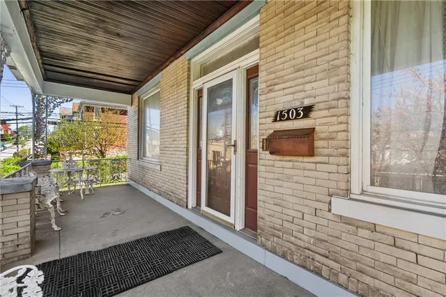 a view of a porch with wooden floor and stairs