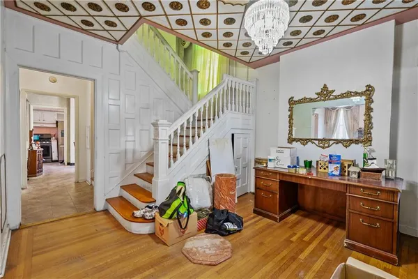 a view of hall way with furniture