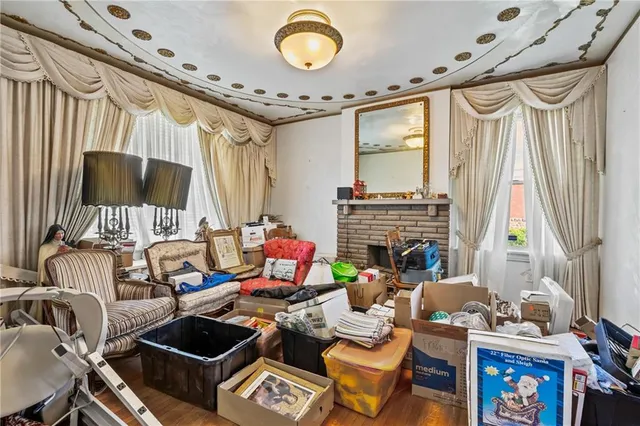 a living room with fireplace furniture and a chandelier