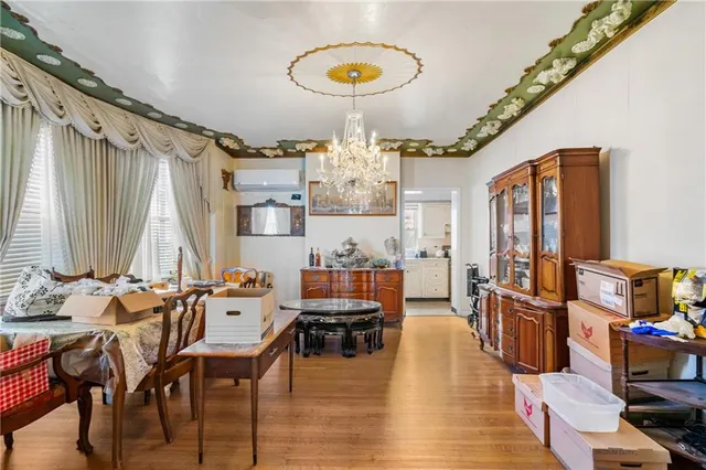 a view of a dining room with furniture and chandelier