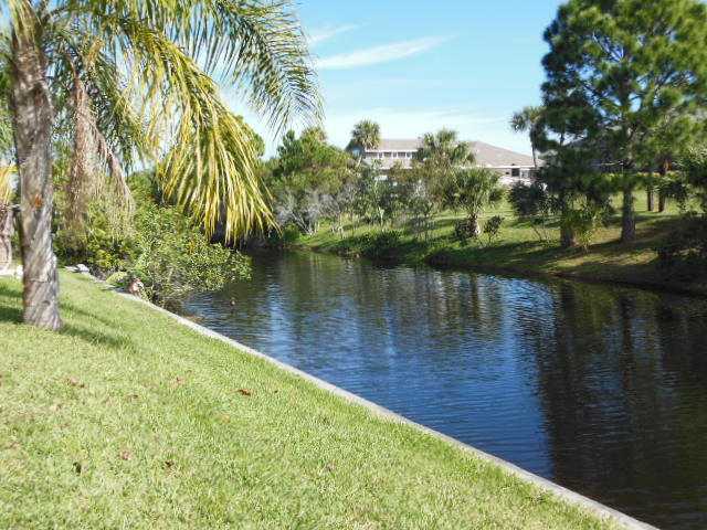 865 George Street Sebastian, FL 32958 - Photo 9 of 10 a view of a lake with a yard