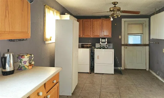 a kitchen with a refrigerator and a sink