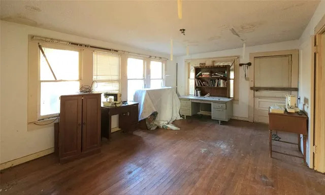 a view of workspace with furniture and window