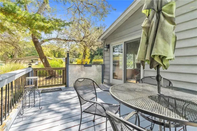 a view of a chair and tables in the balcony