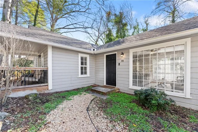 a front view of a house with garden