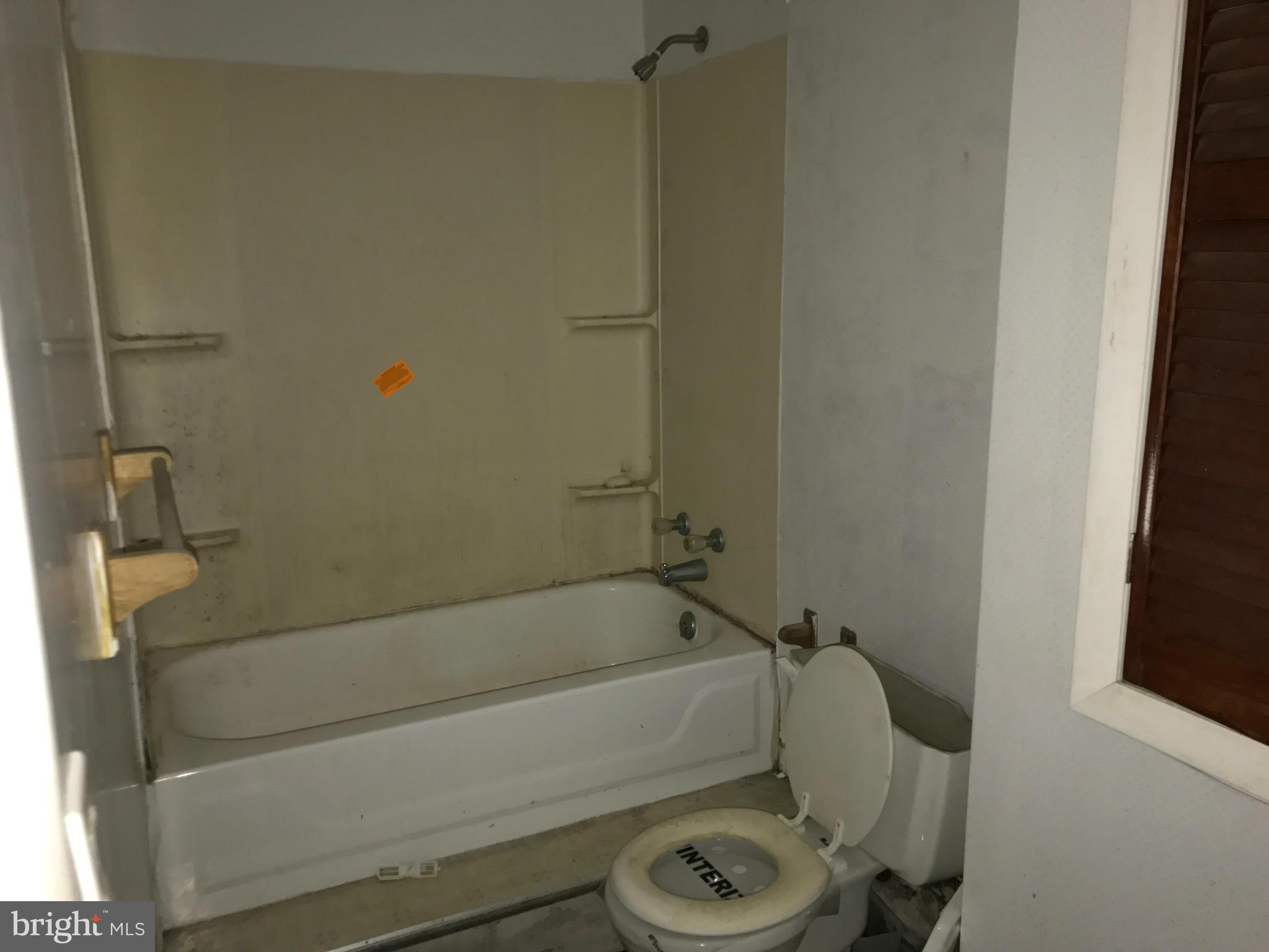 10178 High Ridge Road Laurel, MD 20723 - Photo 15 of 18 a bathroom with a tub and a shower