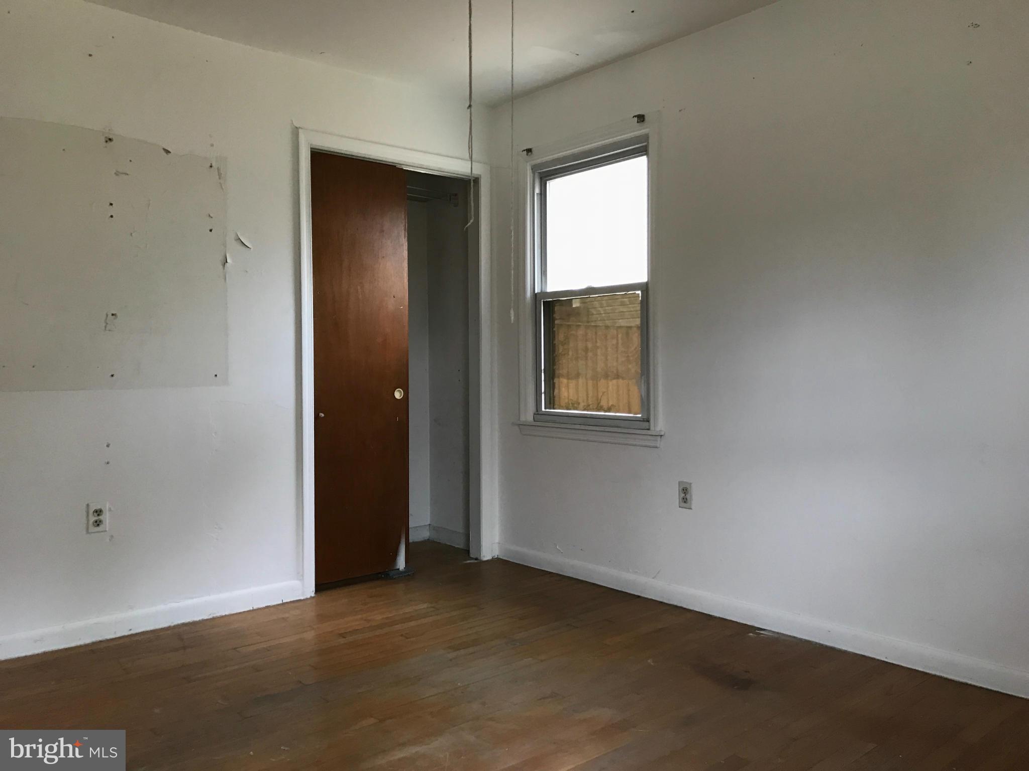 10178 High Ridge Road Laurel, MD 20723 - Photo 7 of 18 an empty room with windows and closet