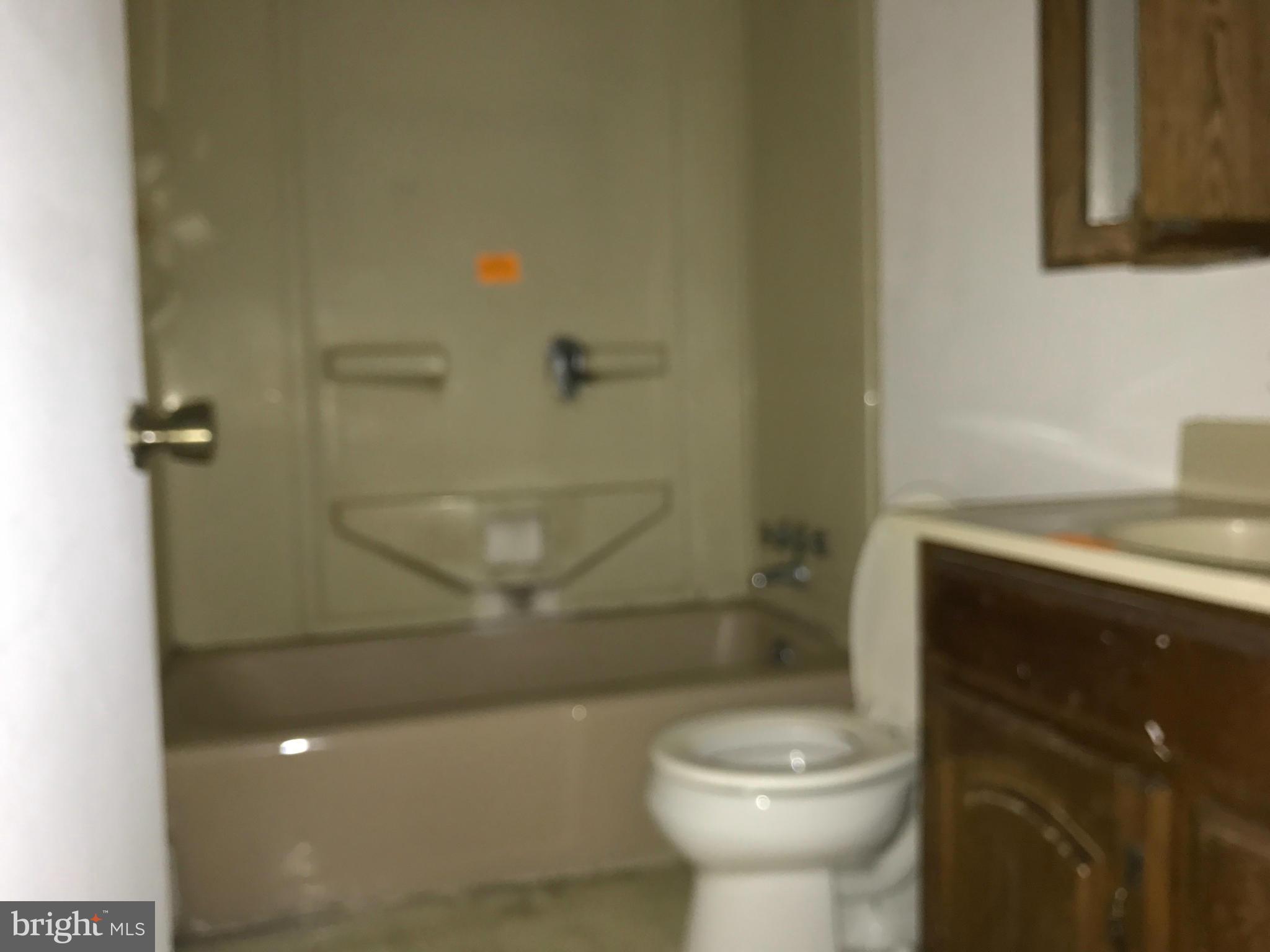 10178 High Ridge Road Laurel, MD 20723 - Photo 9 of 18 a bathroom with a toilet and a shower