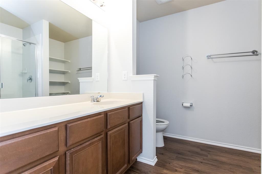 2103 Meadow Park Drive Princeton, TX 75407 - Photo 12 of 30 a bathroom with a sink and a mirror