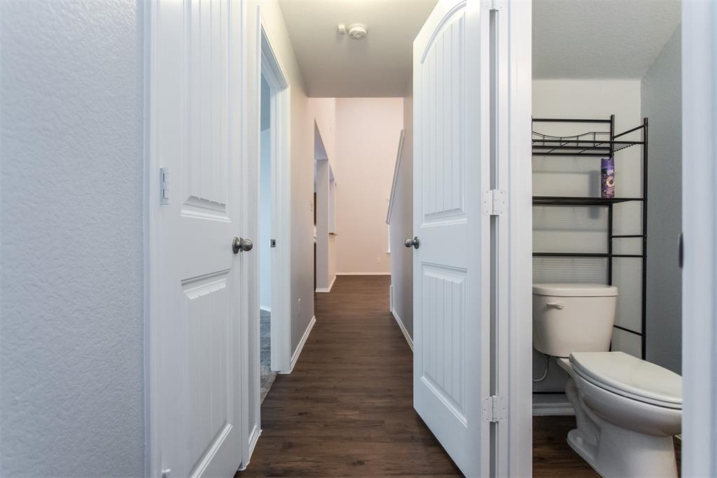 2103 Meadow Park Drive Princeton, TX 75407 - Photo 19 of 30 a bathroom with a toilet and a shower