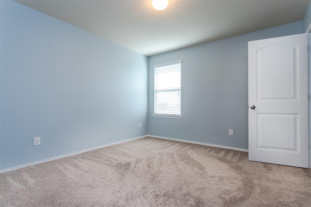 2103 Meadow Park Drive Princeton, TX 75407 - Photo 23 of 30 a view of an empty room with a window