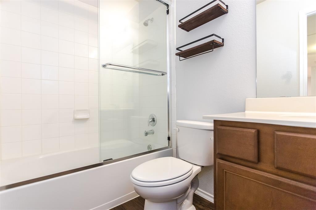2103 Meadow Park Drive Princeton, TX 75407 - Photo 27 of 30 a bathroom with a sink a toilet and a shower