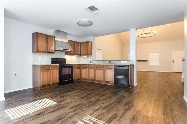 a kitchen with a sink cabinets and window