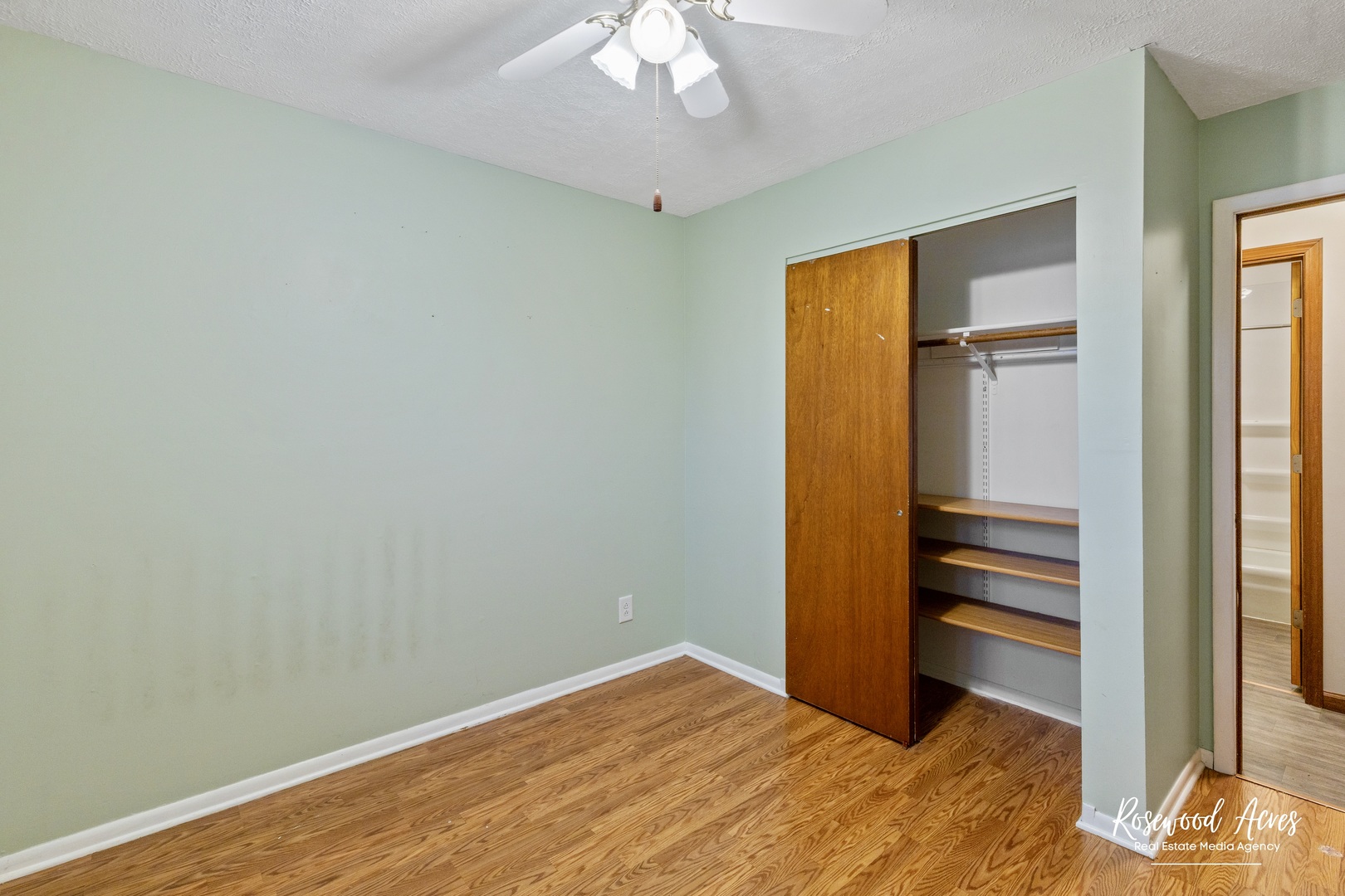 209 West Indiana Street Momence, IL 60954 - Photo 18 of 34 a bedroom with a bed and a chandelier