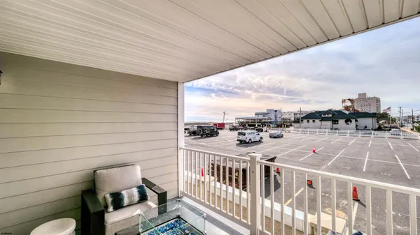 a view of a balcony with furniture