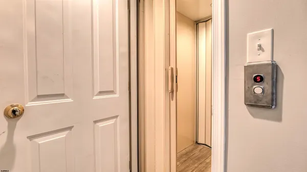 a view of a bedroom from a hallway