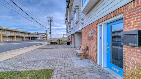 a view of a brick house with a street