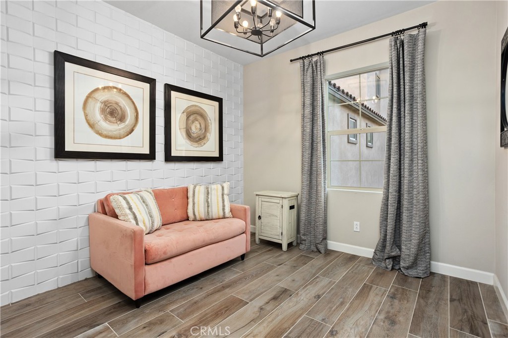4366 Pacifica Way, Unit 7 Oceanside, CA 92056 - Photo 11 of 36 a living room with furniture and a wooden floor