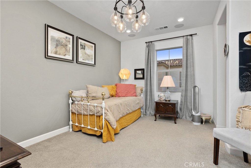 4366 Pacifica Way, Unit 7 Oceanside, CA 92056 - Photo 15 of 36 a bedroom with bed and window