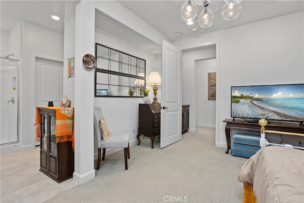 4366 Pacifica Way, Unit 7 Oceanside, CA 92056 - Photo 16 of 36 a view of a livingroom with furniture and a flat screen tv