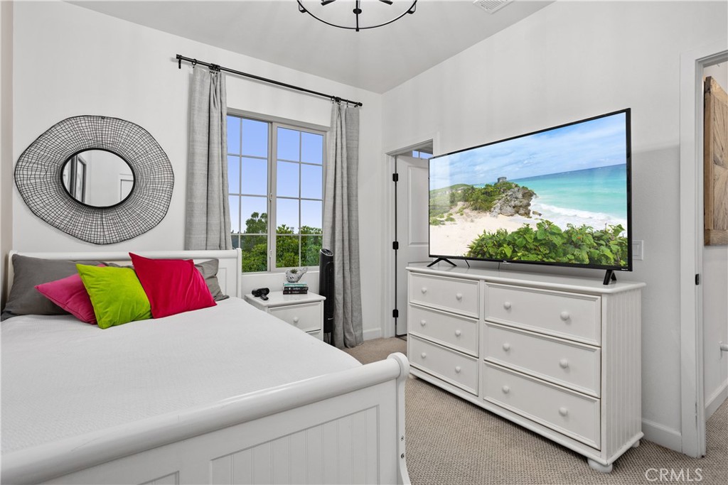 4366 Pacifica Way, Unit 7 Oceanside, CA 92056 - Photo 20 of 36 a bedroom with a bed and window