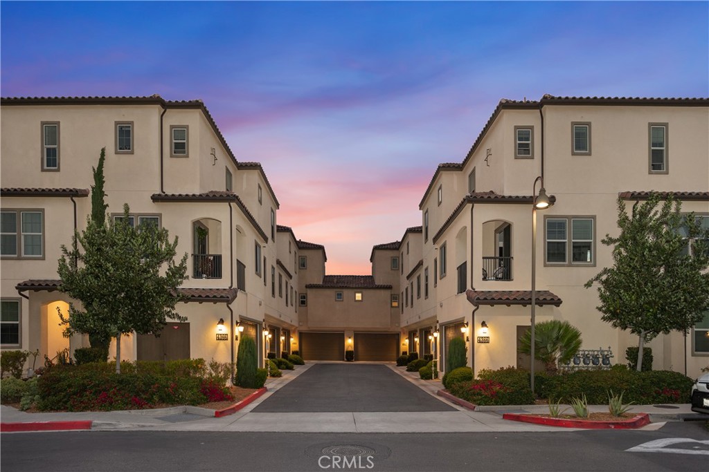 4366 Pacifica Way, Unit 7 Oceanside, CA 92056 - Photo 21 of 36 a front view of residential houses with street