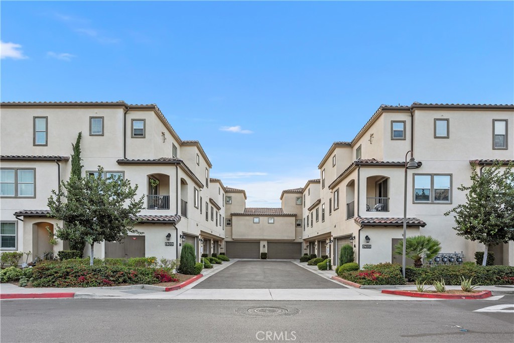 4366 Pacifica Way, Unit 7 Oceanside, CA 92056 - Photo 22 of 36 a front view of residential houses with street