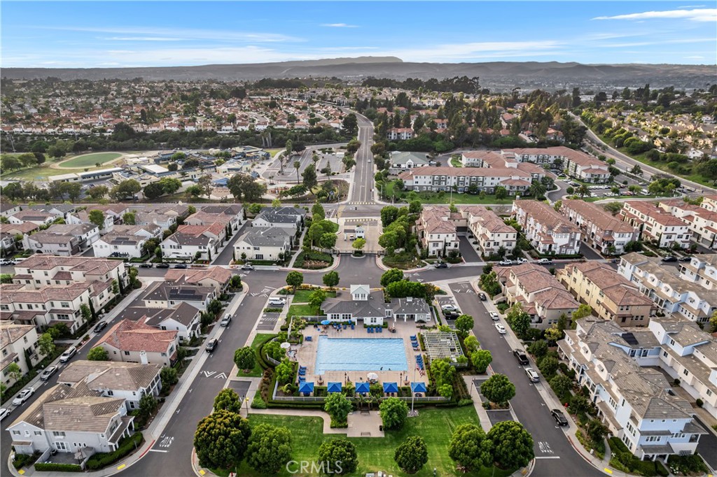 4366 Pacifica Way, Unit 7 Oceanside, CA 92056 - Photo 29 of 36 an aerial view of a city with lots of residential buildings ocean and mountain view in back