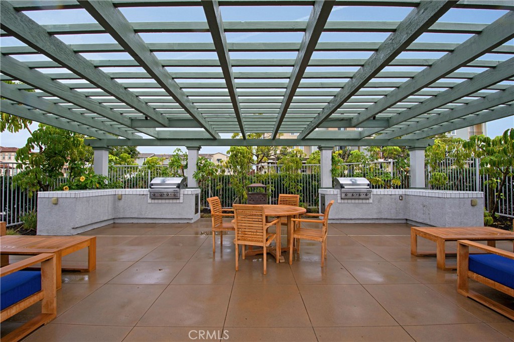 4366 Pacifica Way, Unit 7 Oceanside, CA 92056 - Photo 36 of 36 a outdoor space with lots of furniture and entertaining space