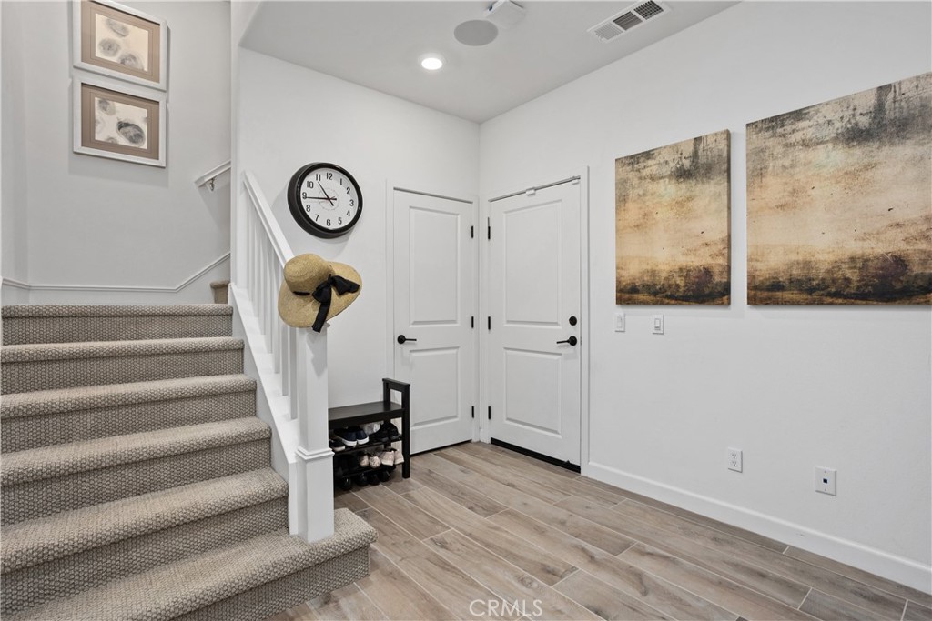 4366 Pacifica Way, Unit 7 Oceanside, CA 92056 - Photo 5 of 36 a view of a hallway with wooden floor and workspace