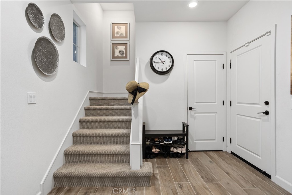 4366 Pacifica Way, Unit 7 Oceanside, CA 92056 - Photo 6 of 36 a view of entryway with furniture and wooden floor
