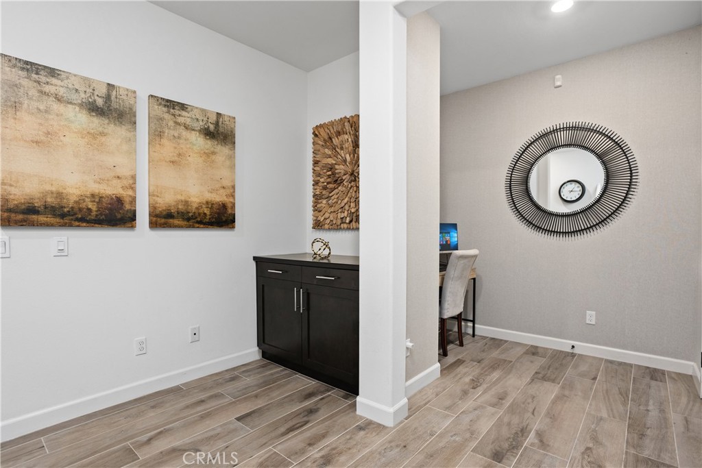 4366 Pacifica Way, Unit 7 Oceanside, CA 92056 - Photo 7 of 36 a view of a room with wooden floor and window