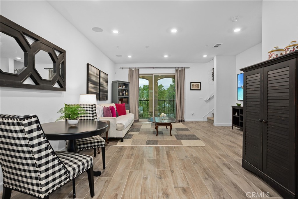 4366 Pacifica Way, Unit 7 Oceanside, CA 92056 - Photo 8 of 36 a living room with furniture and a large window